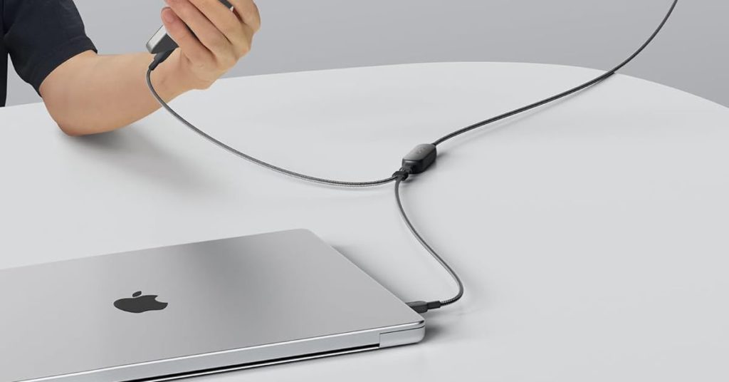 An Apple MacBook and iPhone being simultaneously charged using Anker’s new 2-in-1 USB-C cable.