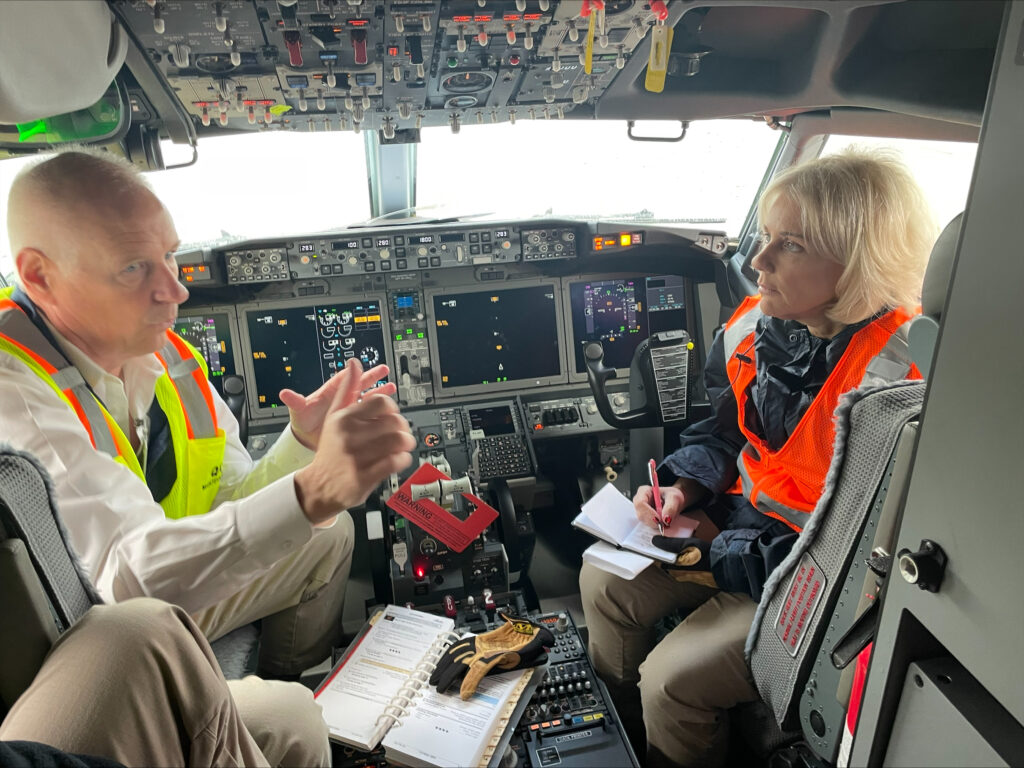 NTSB Chair Jennifer Homendy takes notes during a conversation aboard the Boeing 737 Max 9 involved in Alaska Airlines 1282 on Jan. 5, 2024.